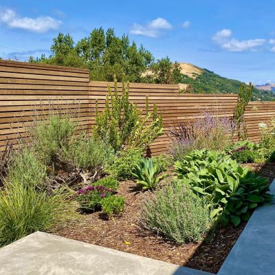 stepped horizontal wood fence and garden