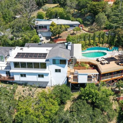 Wood gate in front of house