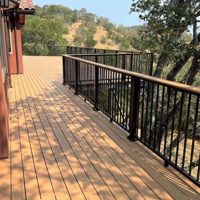 Black metal picket railing on large Timbertech deck.
