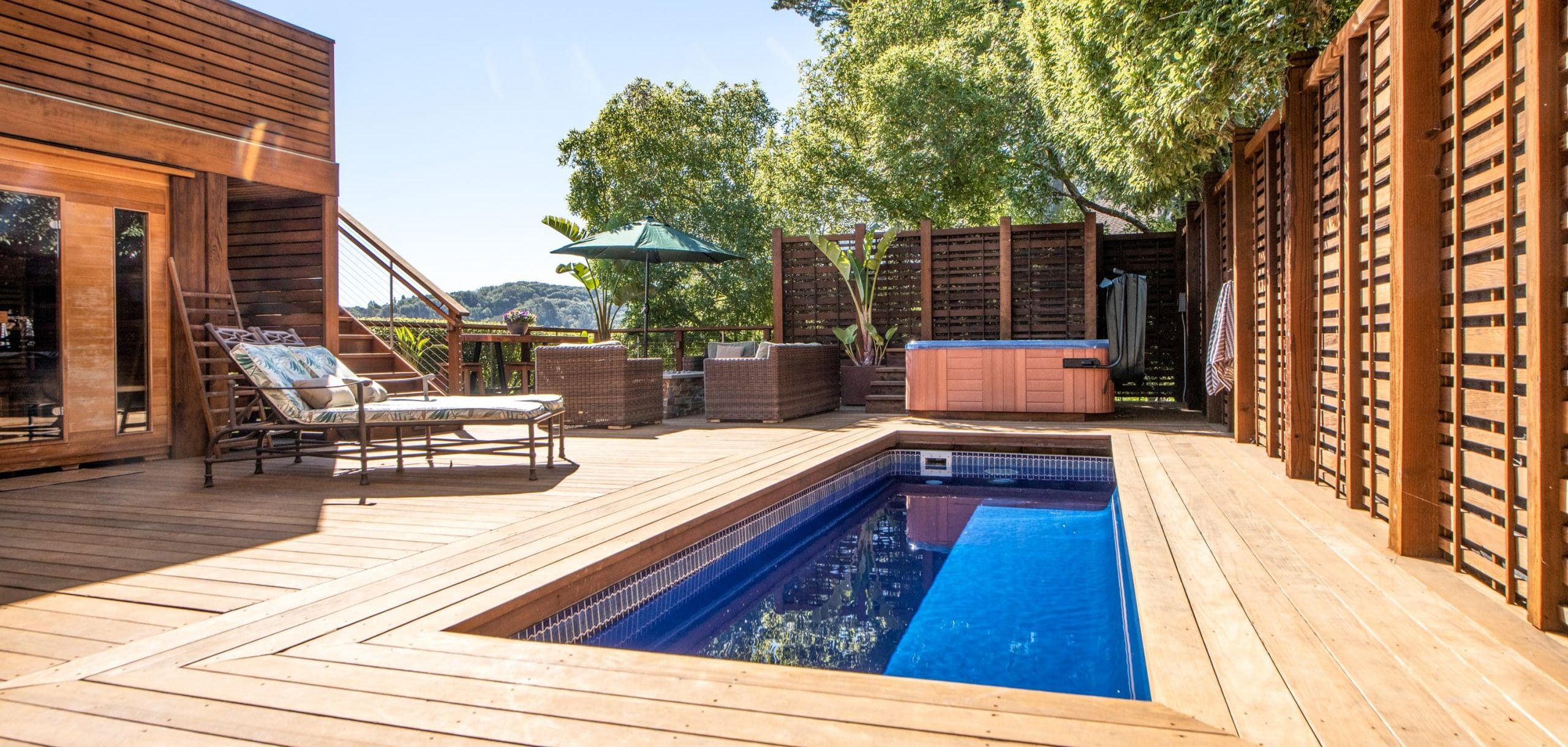 Wood Deck with deep blue lap pool