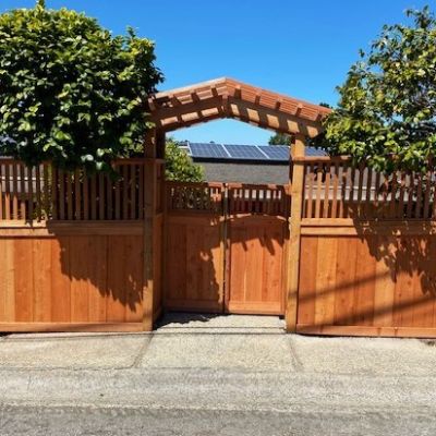 wood fence with gate and arbor